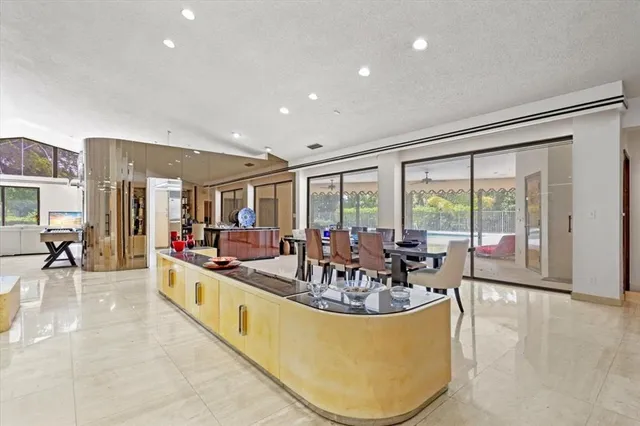 a kitchen with lots of counter top space and stainless steel appliances