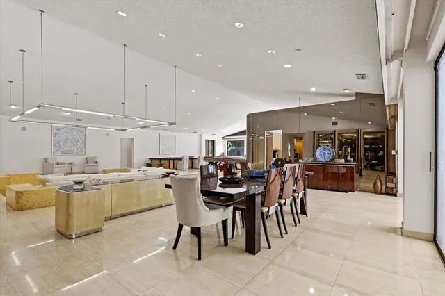 a living room with furniture a window and a table