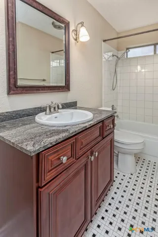 a front view of house with yard and glass windows