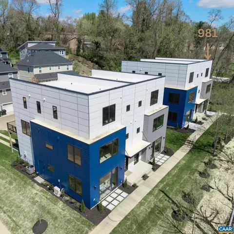 a aerial view of a house with a yard