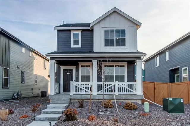 a front view of a house with stairs