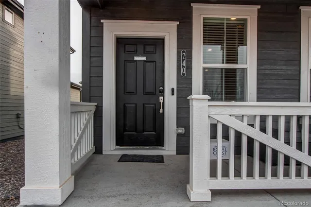 a view of porch with a door and a window