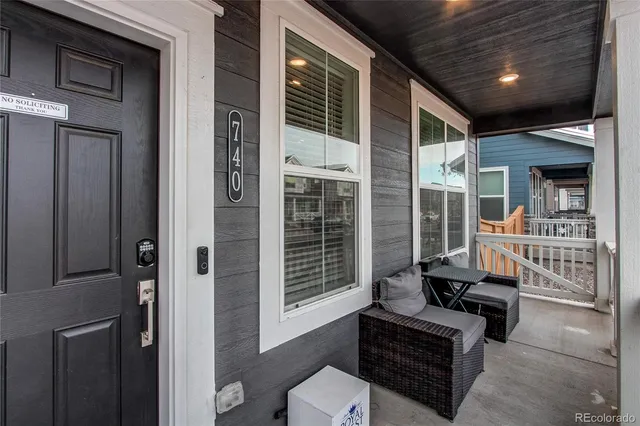 a outdoor living space with patio furniture and a potted plant