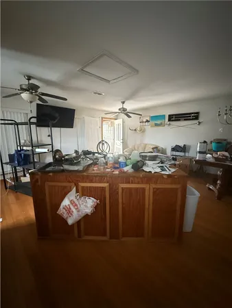 a kitchen with a table chairs stove and cabinets