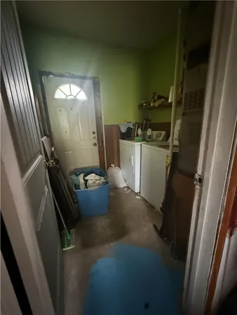 a room with water heater and stairs