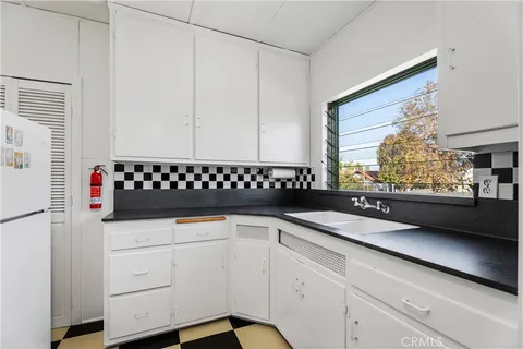 a kitchen with a stove and a microwave