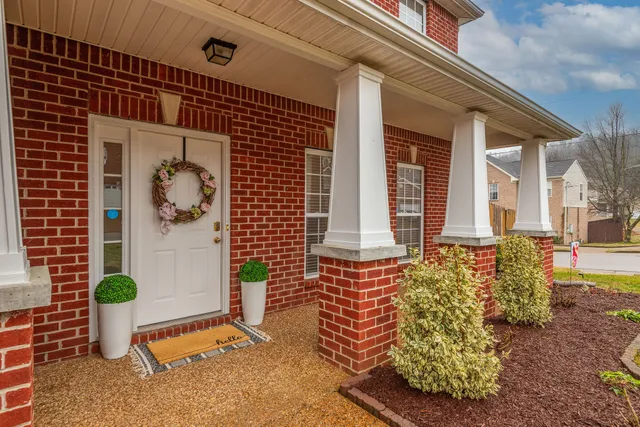 a front view of a house with a porch