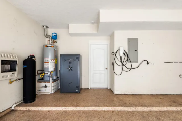 a view of a storage & utility room with refrigerator