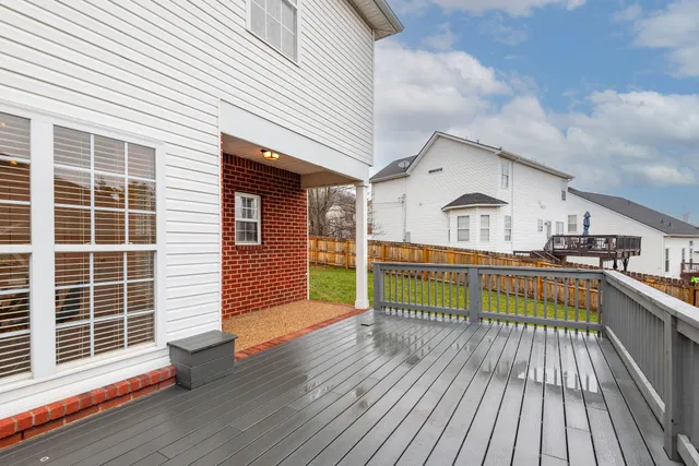 a view of balcony with deck and wooden floor