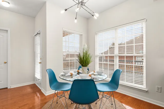 a view of a dining room with furniture window and outside view