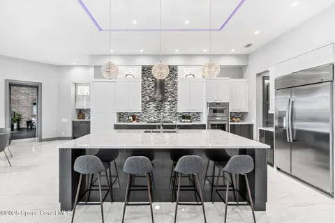 a kitchen with cabinets and stainless steel appliances