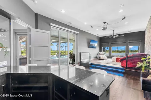 a kitchen with stainless steel appliances granite countertop a sink and a counter space