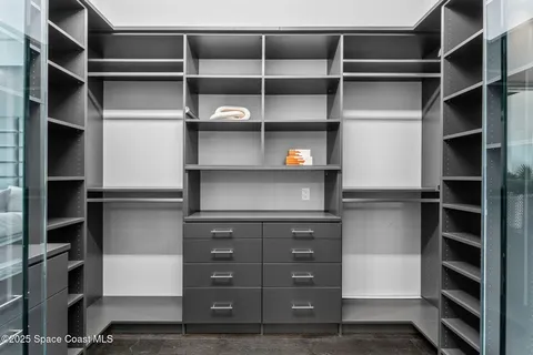 a view of an empty walk in closet