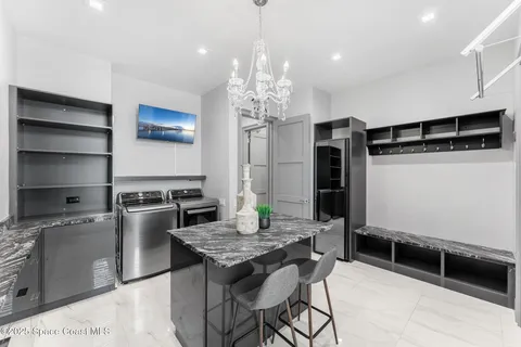 a kitchen with stainless steel appliances granite countertop a stove and a refrigerator