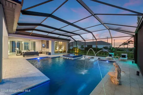 a view of swimming pool with outdoor seating