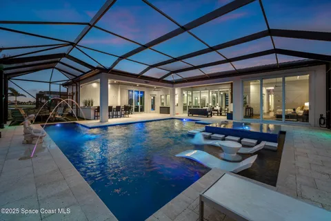 a view of a patio with table and chairs with wooden floor