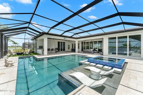 a view of swimming pool with seating area