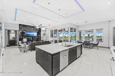 a large kitchen with a table and chairs