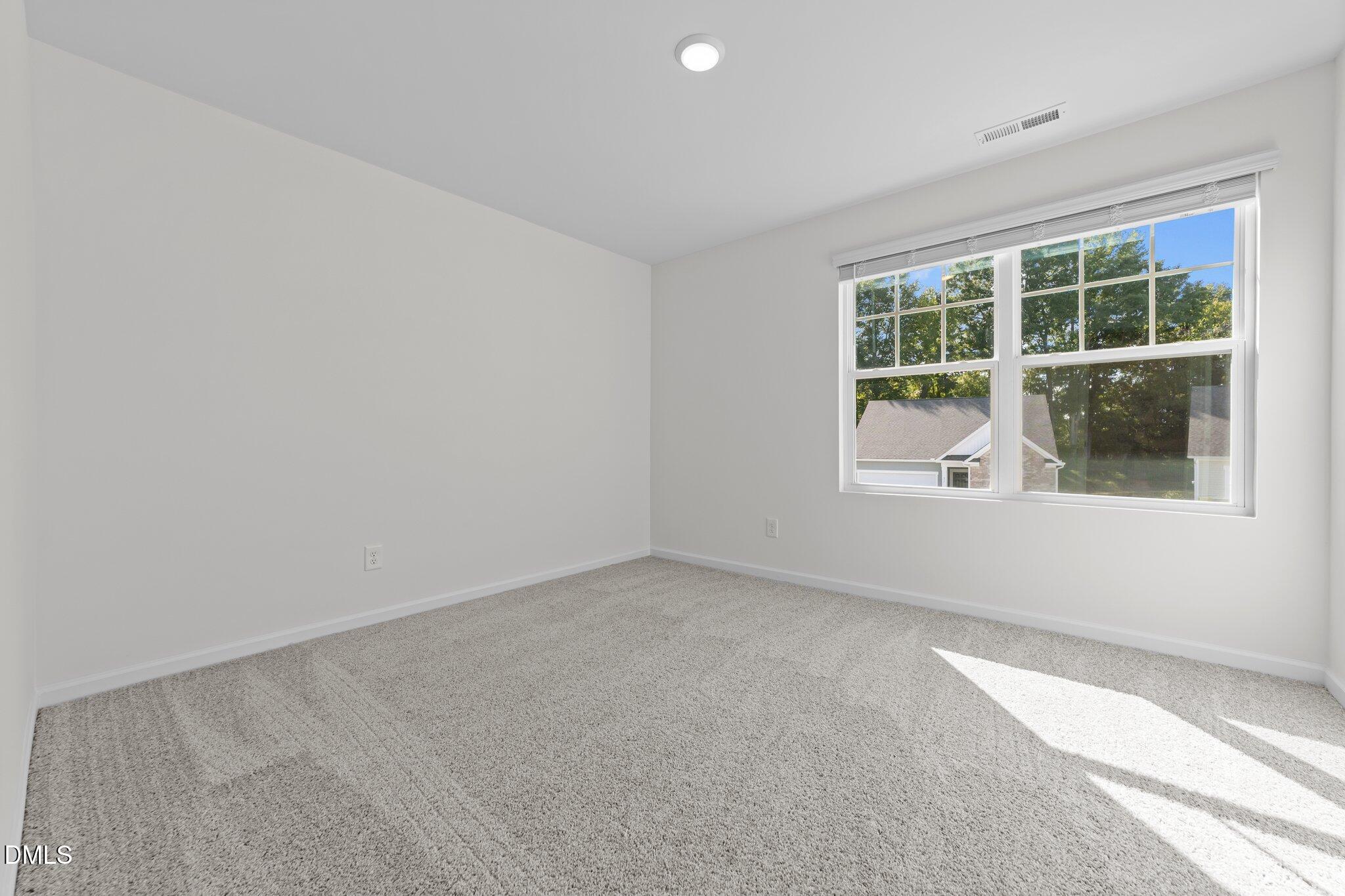 2577 Quarry Road Rolesville, NC 27571 - Photo 32 of 38 an empty room with windows