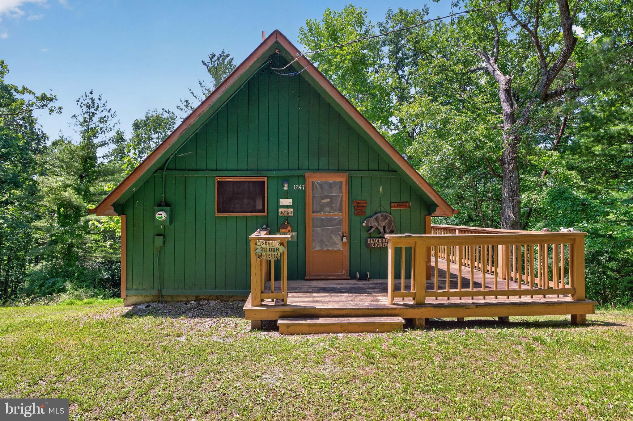 1247 Somers Road Luray, VA 22835 - Photo 25 of 67 a view of backyard with a garden and deck