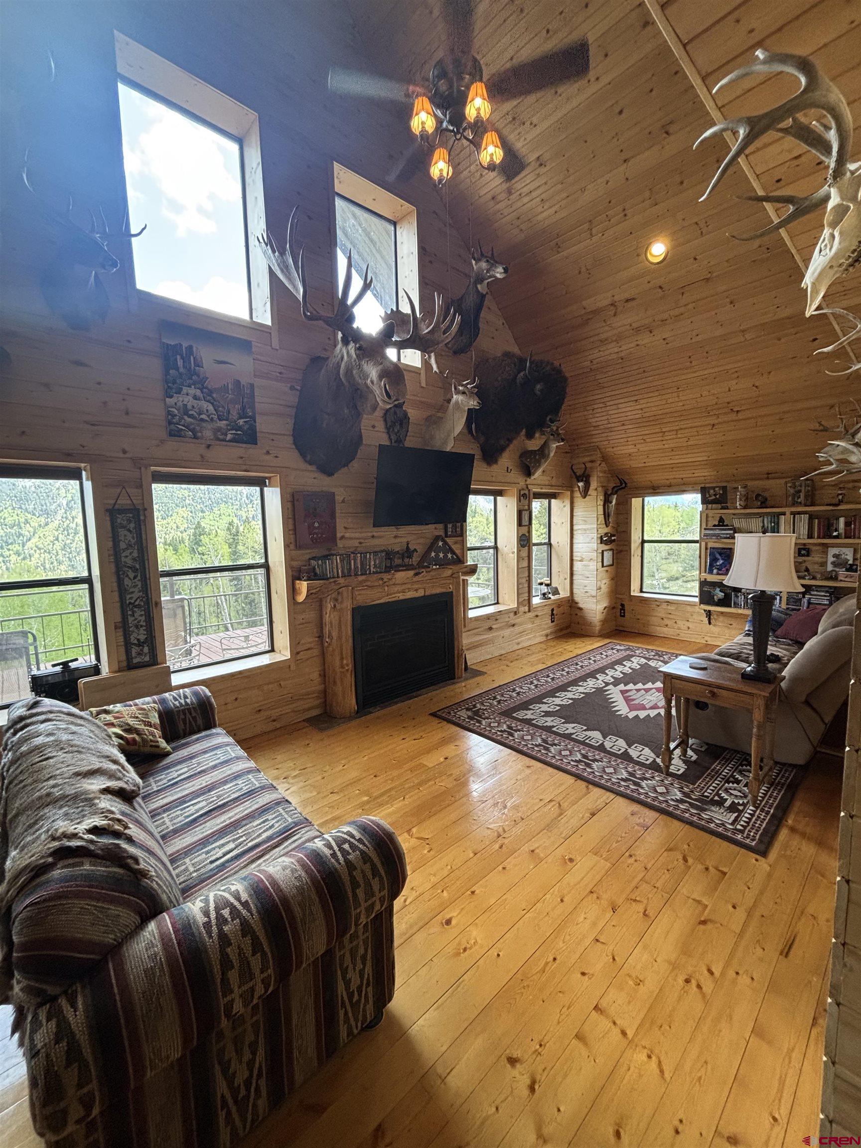 1113 Spring Street Del Norte, CO 81132 - Photo 14 of 43 a spacious bedroom with a bed dresser and a large window