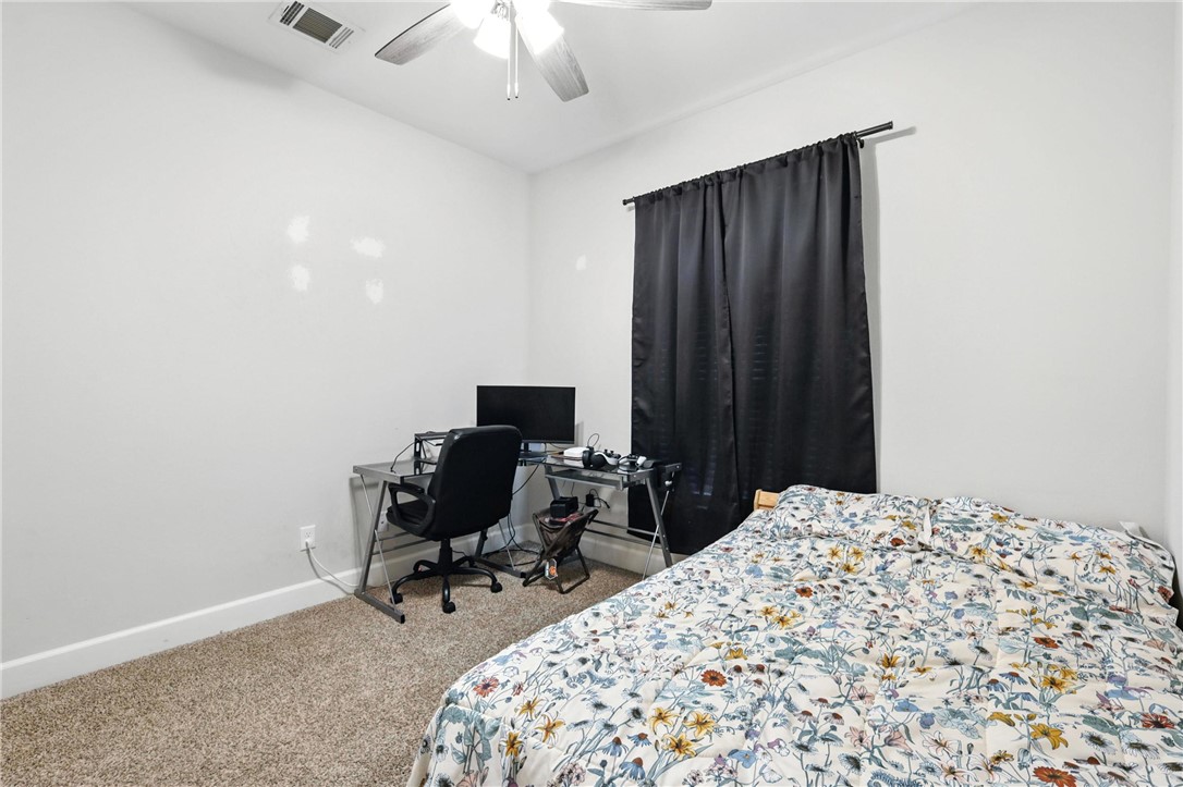 2862 Messenger Way Bryan, TX 77803 - Photo 18 of 22 a bedroom with a bed and a chair