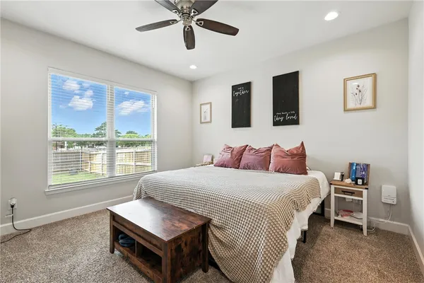 a bedroom with a bed furniture and a window