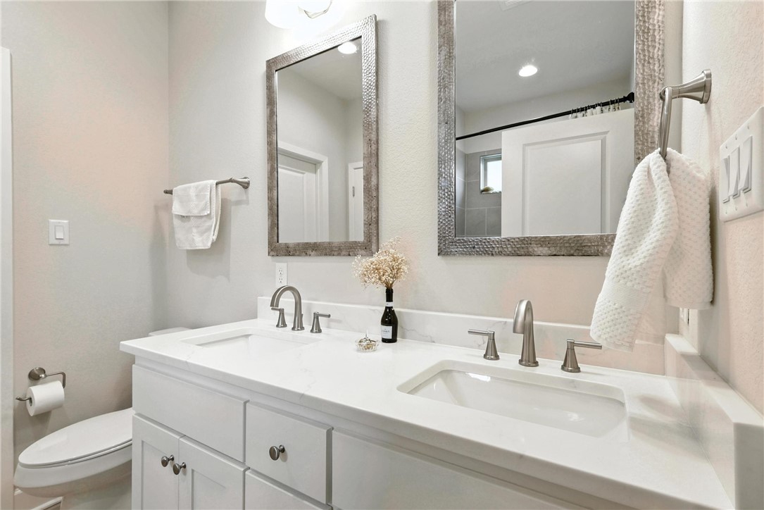 2862 Messenger Way Bryan, TX 77803 - Photo 10 of 22 a bathroom with a sink and a mirror