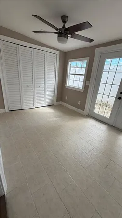 a view of an empty room with a window