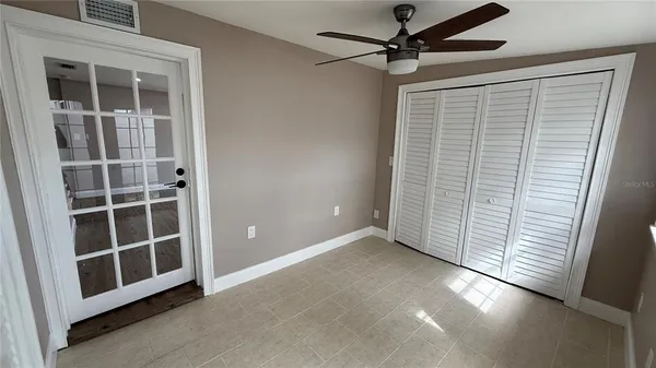 a view of an empty room with a window