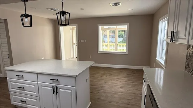 a room with a cabinets and window