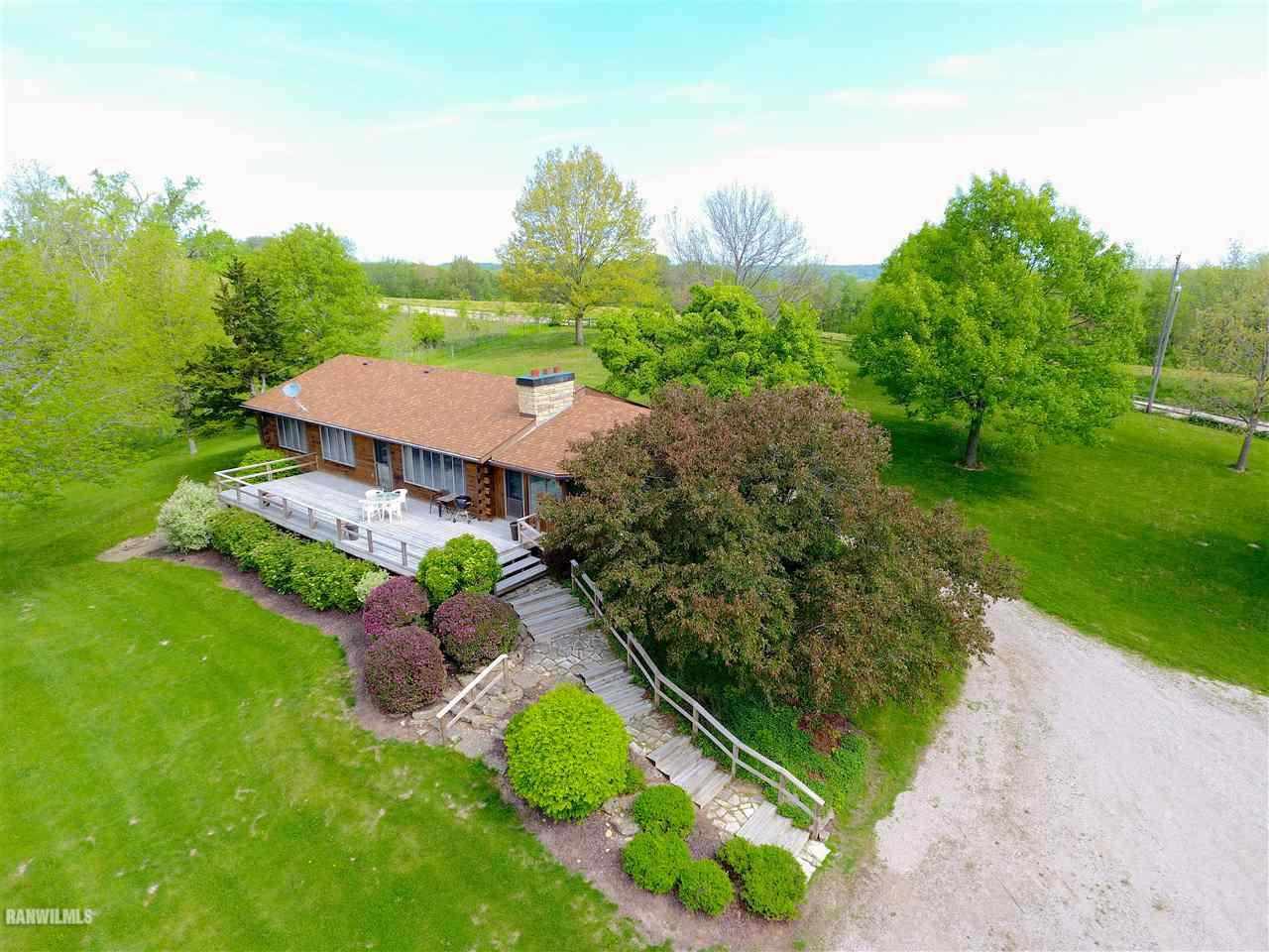 6495 West Blackjack Road Hanover, IL 61041 - Photo 1 of 21 an aerial view of a house with a garden