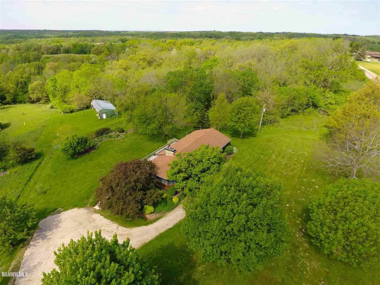 6495 West Blackjack Road Hanover, IL 61041 - Photo 13 of 21 a view of a lake with a yard