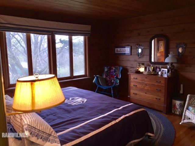 6495 West Blackjack Road Hanover, IL 61041 - Photo 14 of 21 a room with a bed and a television