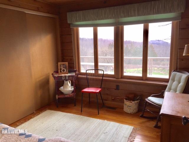 6495 West Blackjack Road Hanover, IL 61041 - Photo 15 of 21 a room with furniture and wooden floor
