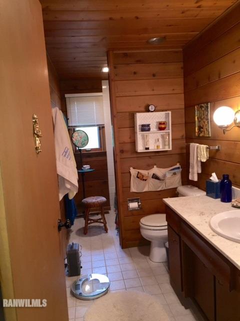 6495 West Blackjack Road Hanover, IL 61041 - Photo 17 of 21 a bathroom with a toilet a sink and mirror