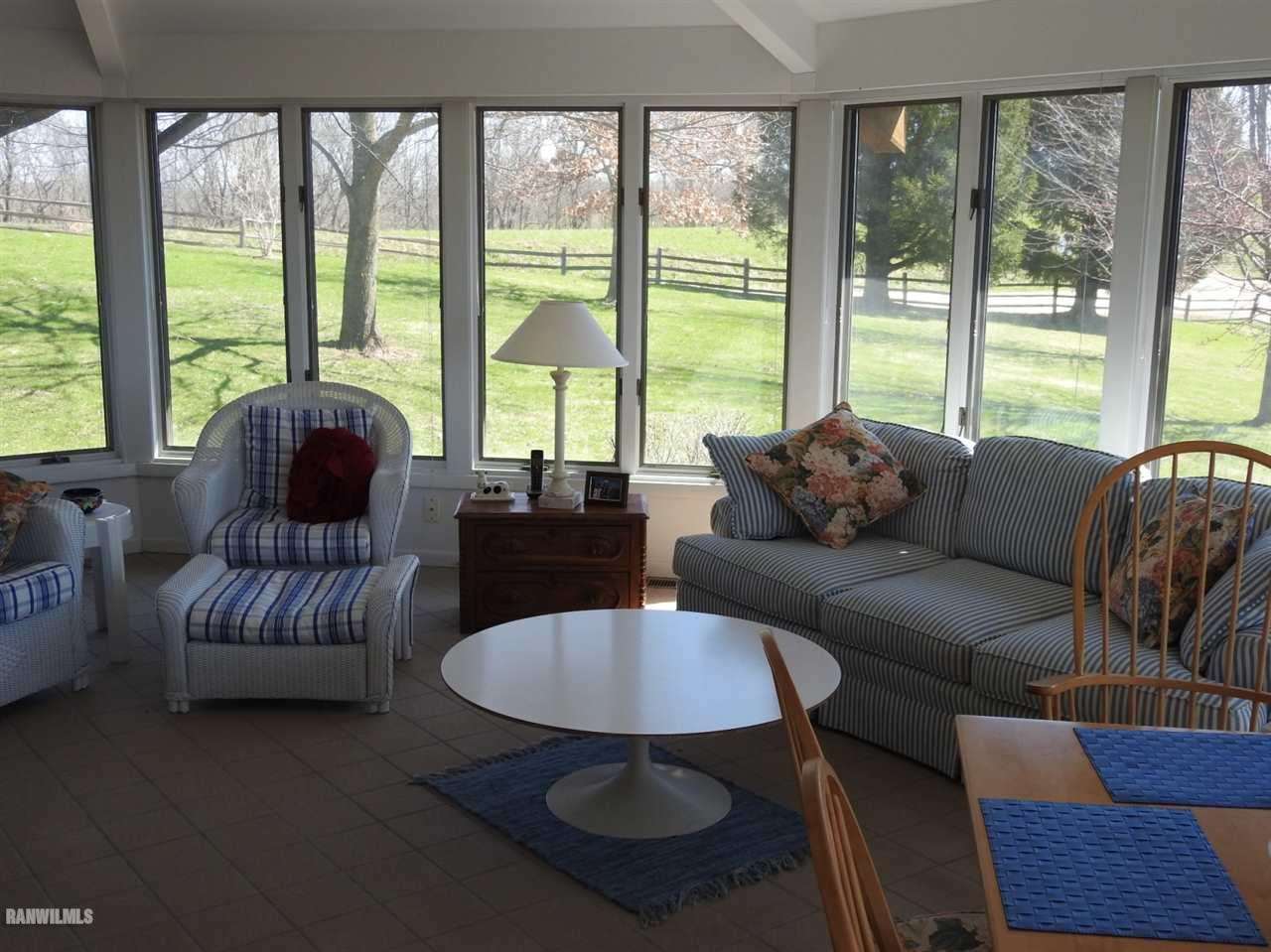 6495 West Blackjack Road Hanover, IL 61041 - Photo 3 of 21 a living room with furniture and a large window