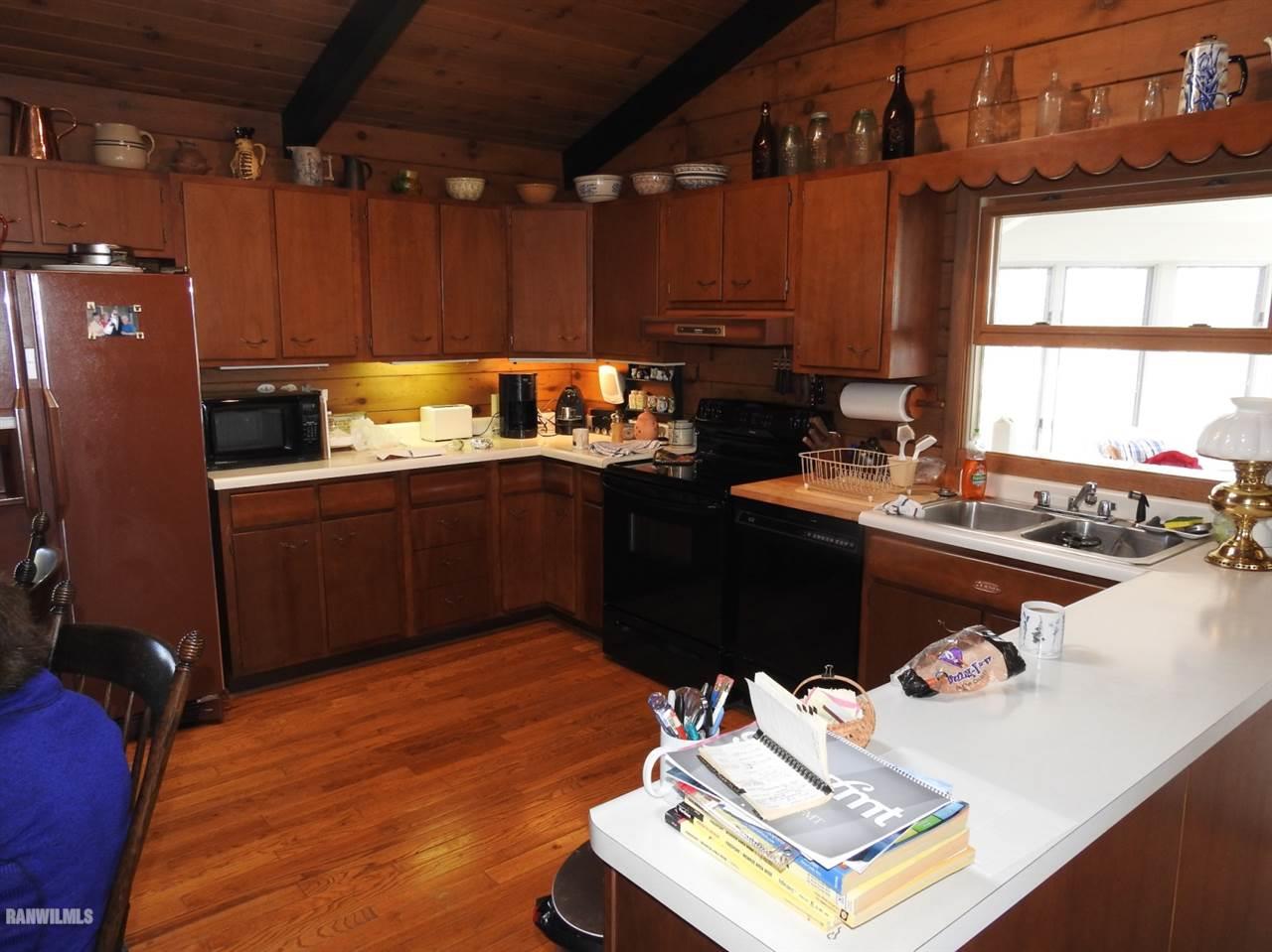 6495 West Blackjack Road Hanover, IL 61041 - Photo 9 of 21 a kitchen with a sink cabinets and window