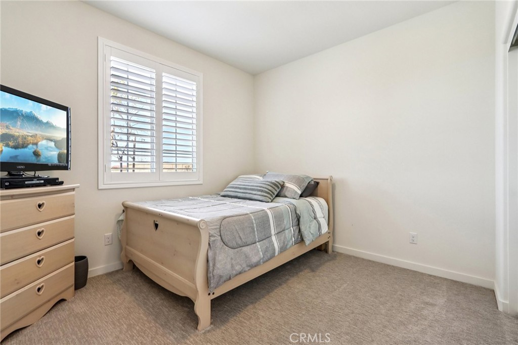 35293 Funk Way Beaumont, CA 92223 - Photo 18 of 70 a bedroom with a bed and a flat screen tv