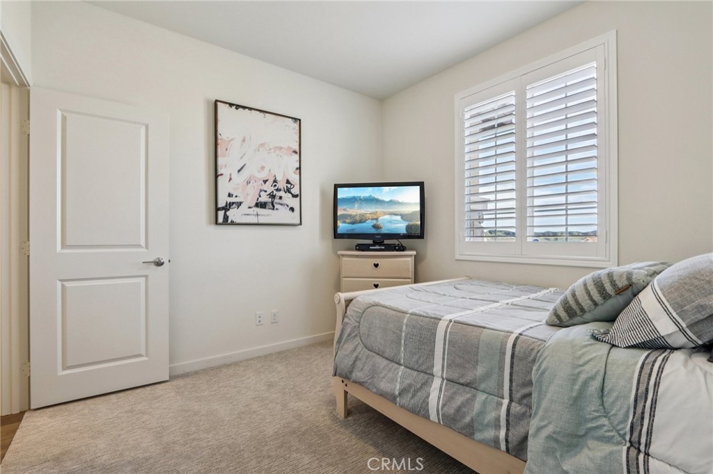 35293 Funk Way Beaumont, CA 92223 - Photo 19 of 70 a bedroom with a bed and a flat screen tv