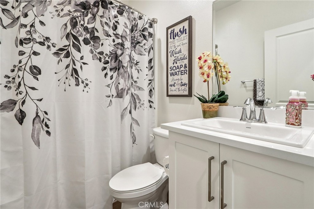 35293 Funk Way Beaumont, CA 92223 - Photo 21 of 70 a bathroom with a toilet sink and mirror