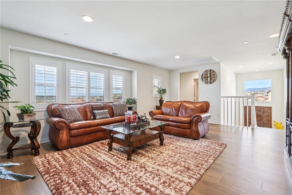 35293 Funk Way Beaumont, CA 92223 - Photo 22 of 70 a living room with furniture a couch and wooden floor
