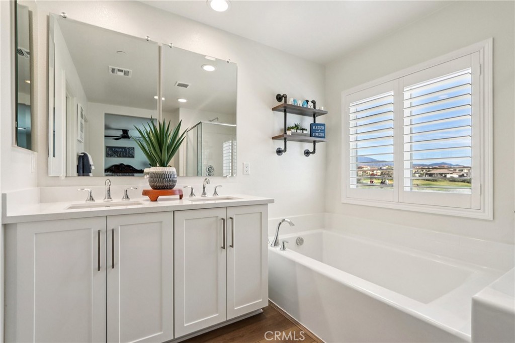 35293 Funk Way Beaumont, CA 92223 - Photo 30 of 70 a bathroom with a bathtub a sink and a window