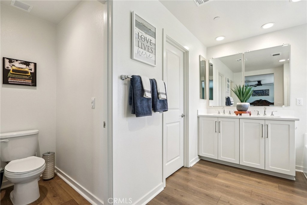 35293 Funk Way Beaumont, CA 92223 - Photo 33 of 70 a bathroom with a toilet sink and mirror