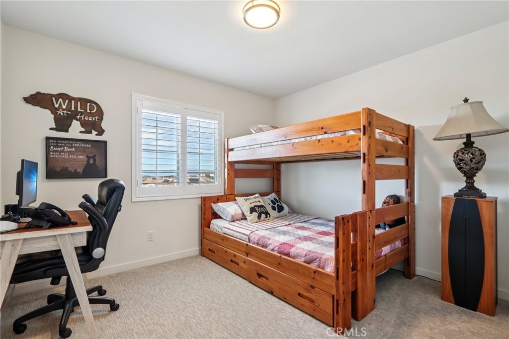 35293 Funk Way Beaumont, CA 92223 - Photo 35 of 70 a bedroom with a bed and a desk