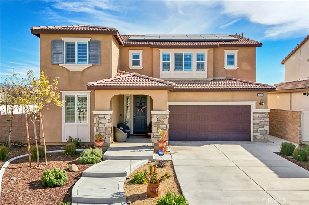 35293 Funk Way Beaumont, CA 92223 - Photo 4 of 70 a front view of a house with a yard and garage