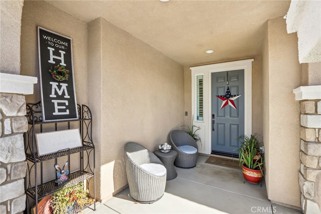 35293 Funk Way Beaumont, CA 92223 - Photo 5 of 70 a living room with furniture and a potted plant