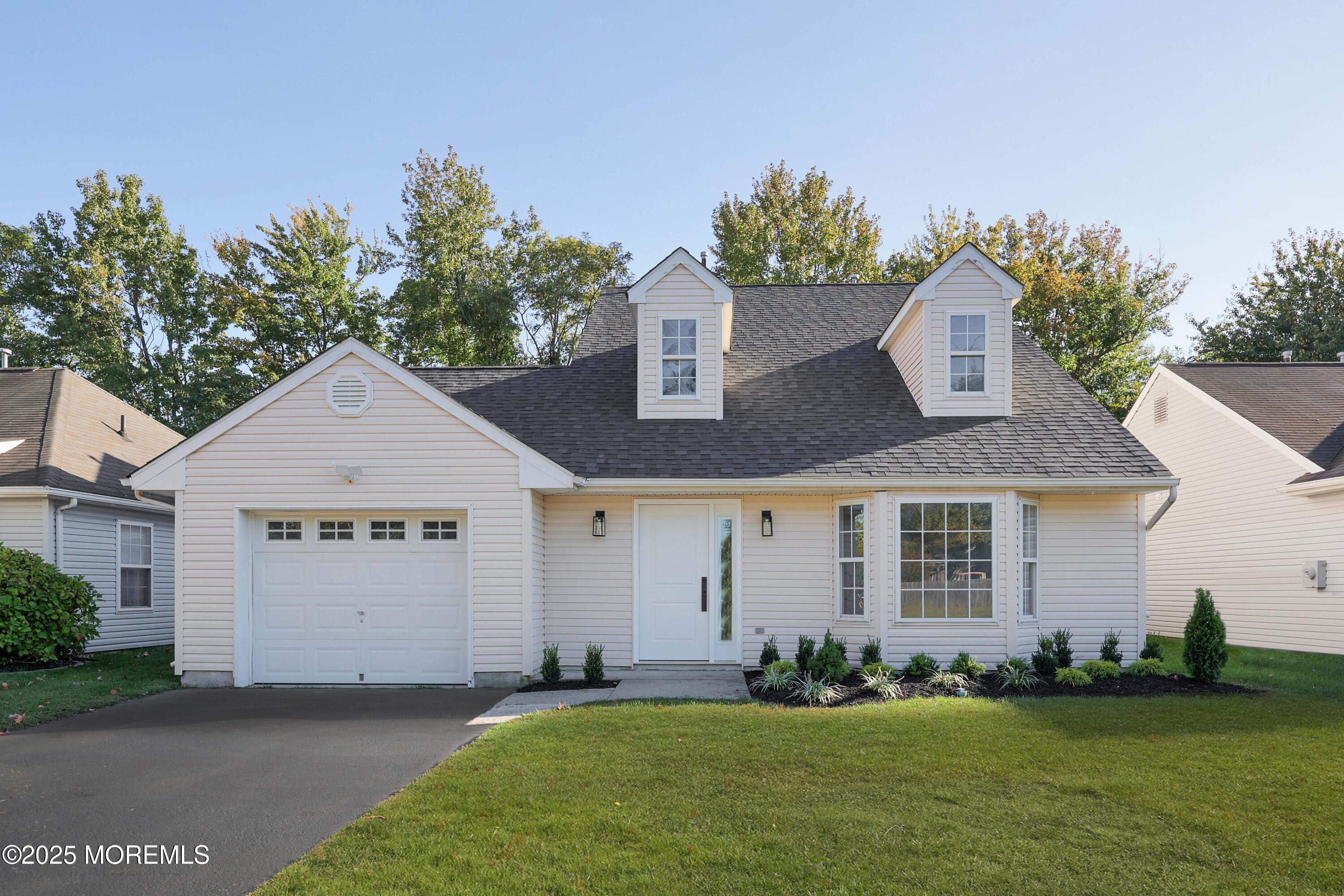 4 Ellison Court Union Beach, NJ 07735 - Photo 1 of 35 a front view of a house with a garden and yard