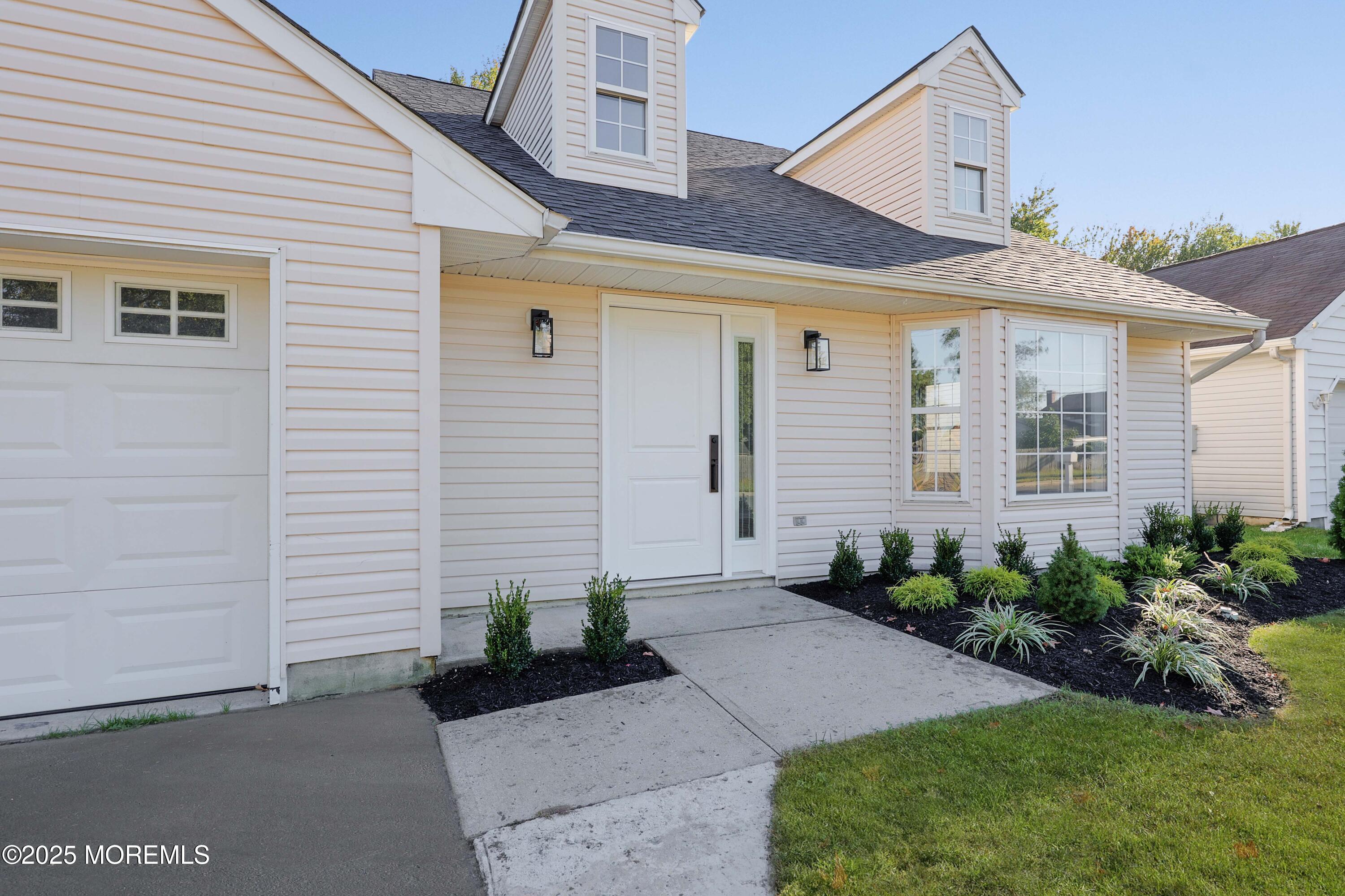 4 Ellison Court Union Beach, NJ 07735 - Photo 26 of 35 a front view of a house with garden