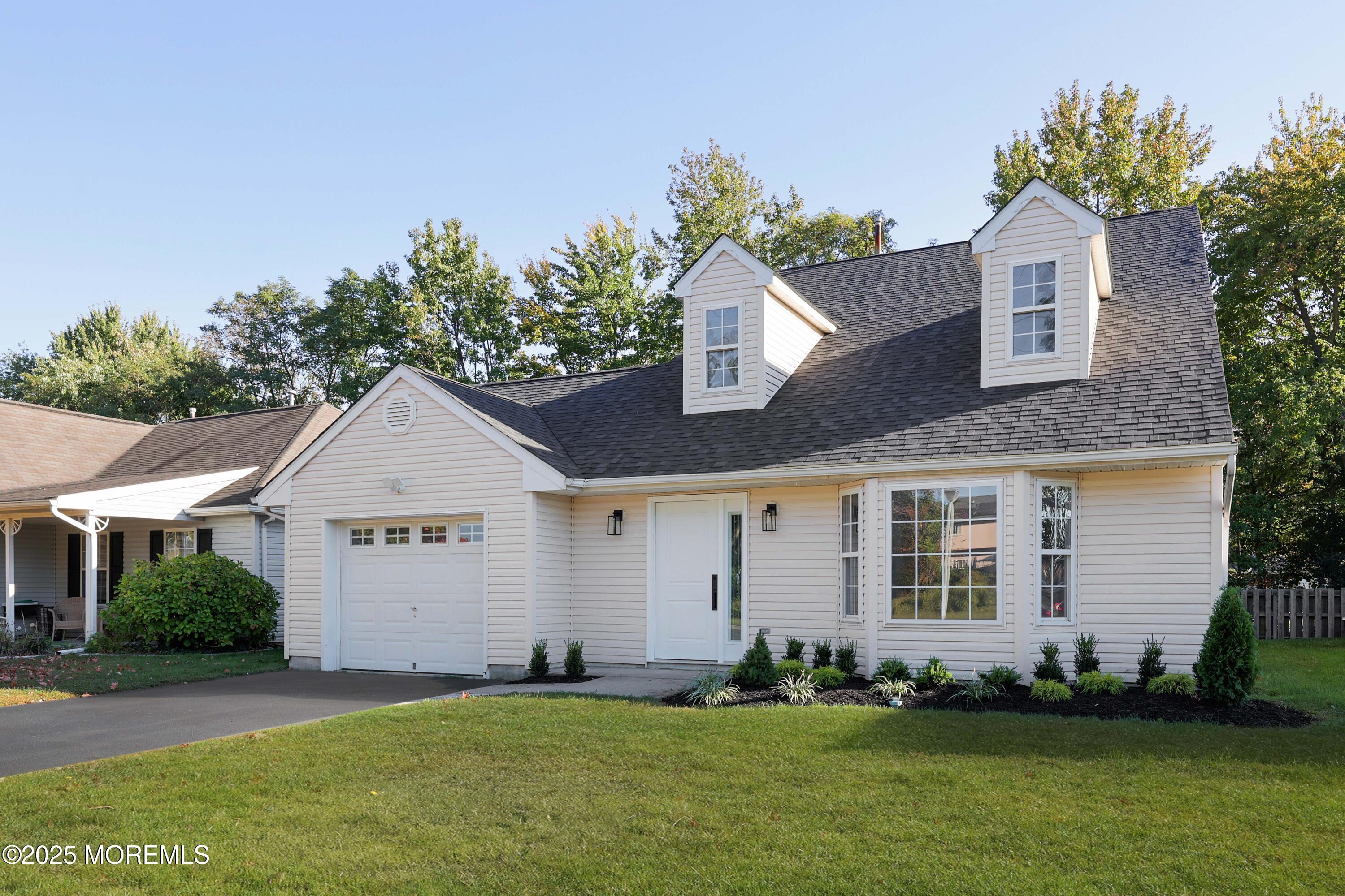 4 Ellison Court Union Beach, NJ 07735 - Photo 32 of 35 a front view of a house with a garden